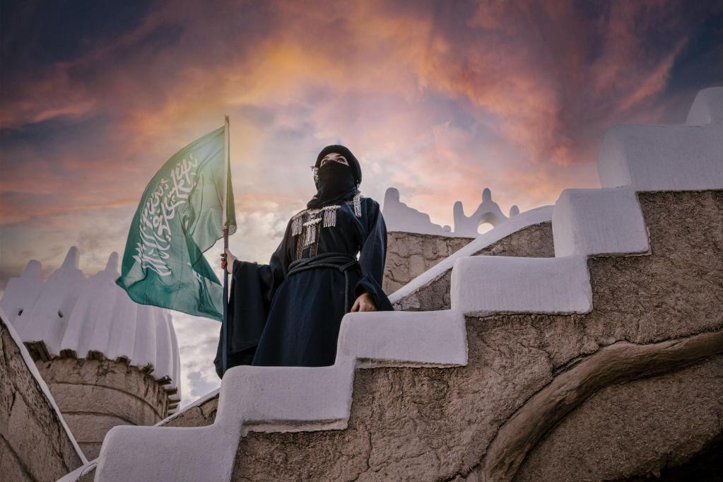 Saudi Woman Holding Flag