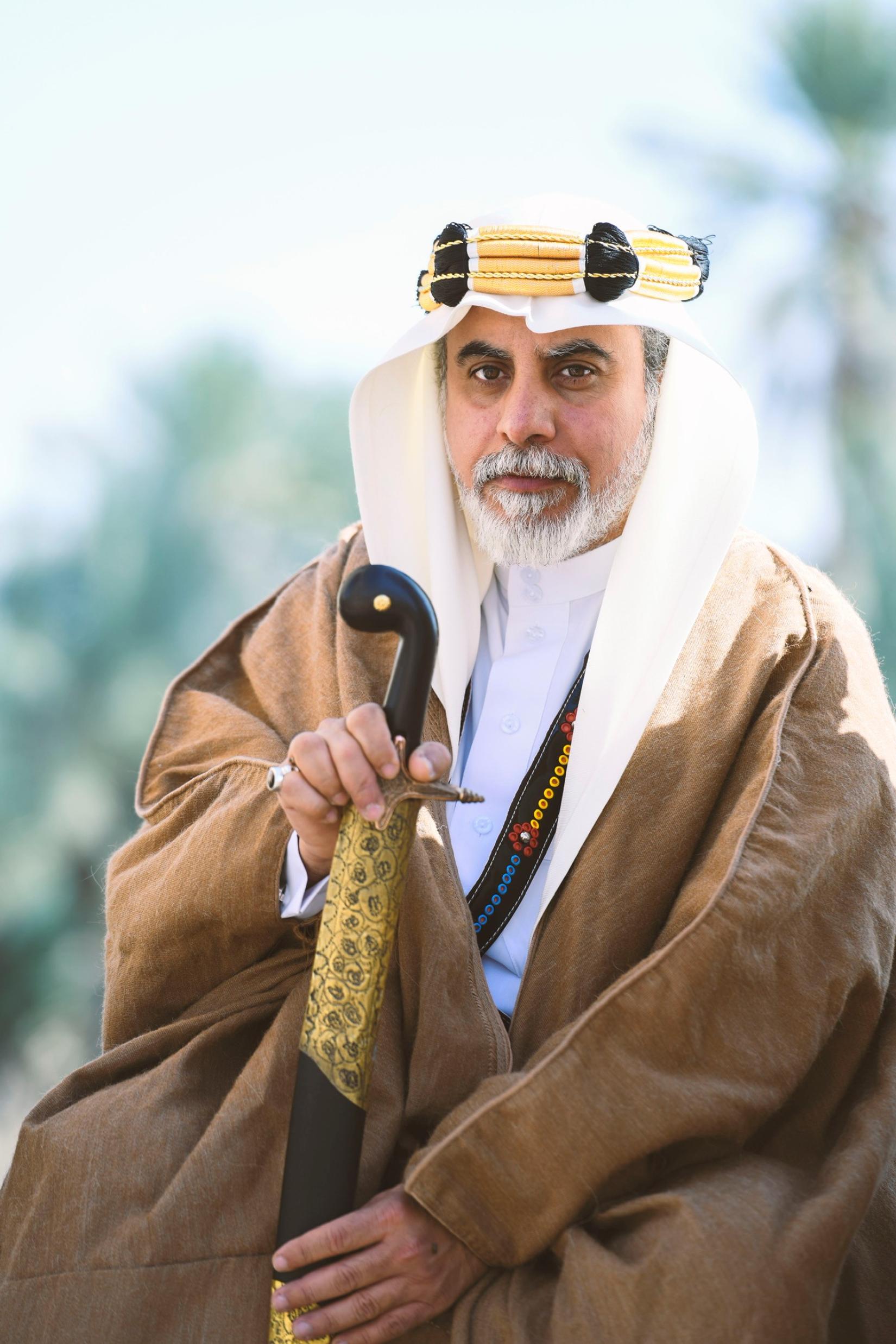 Saudi man holding sword in tradtional attire